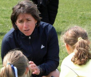 Dr. Dina Gentile on the field coaching her team