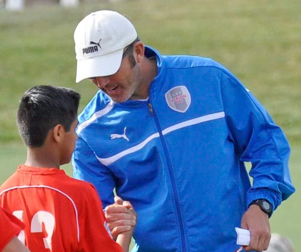 Albion SC's Noah GIns speaks with a player before California Regional League soccer match