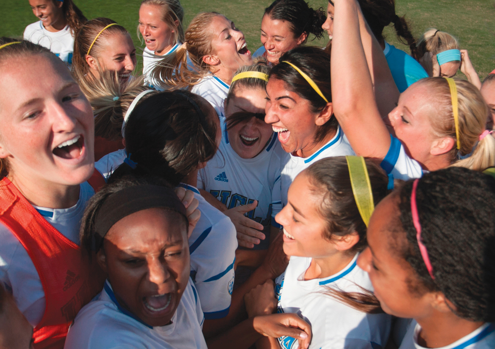 The UCLA women's soccer team celebrates after securing the Pac-!2 regular season championship Sunday.