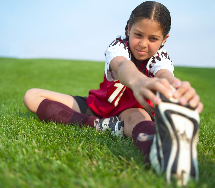 Little Soccer Player Stretching