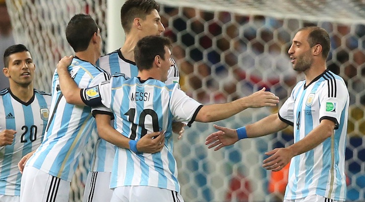 soccer news - RIO DE JANEIRO, BRAZIL - June 15, 2014: Messi and team members from Argentina celebrate a goal in the World Cup Group F game between Argentina and Bosnia at Maracana Stadium.