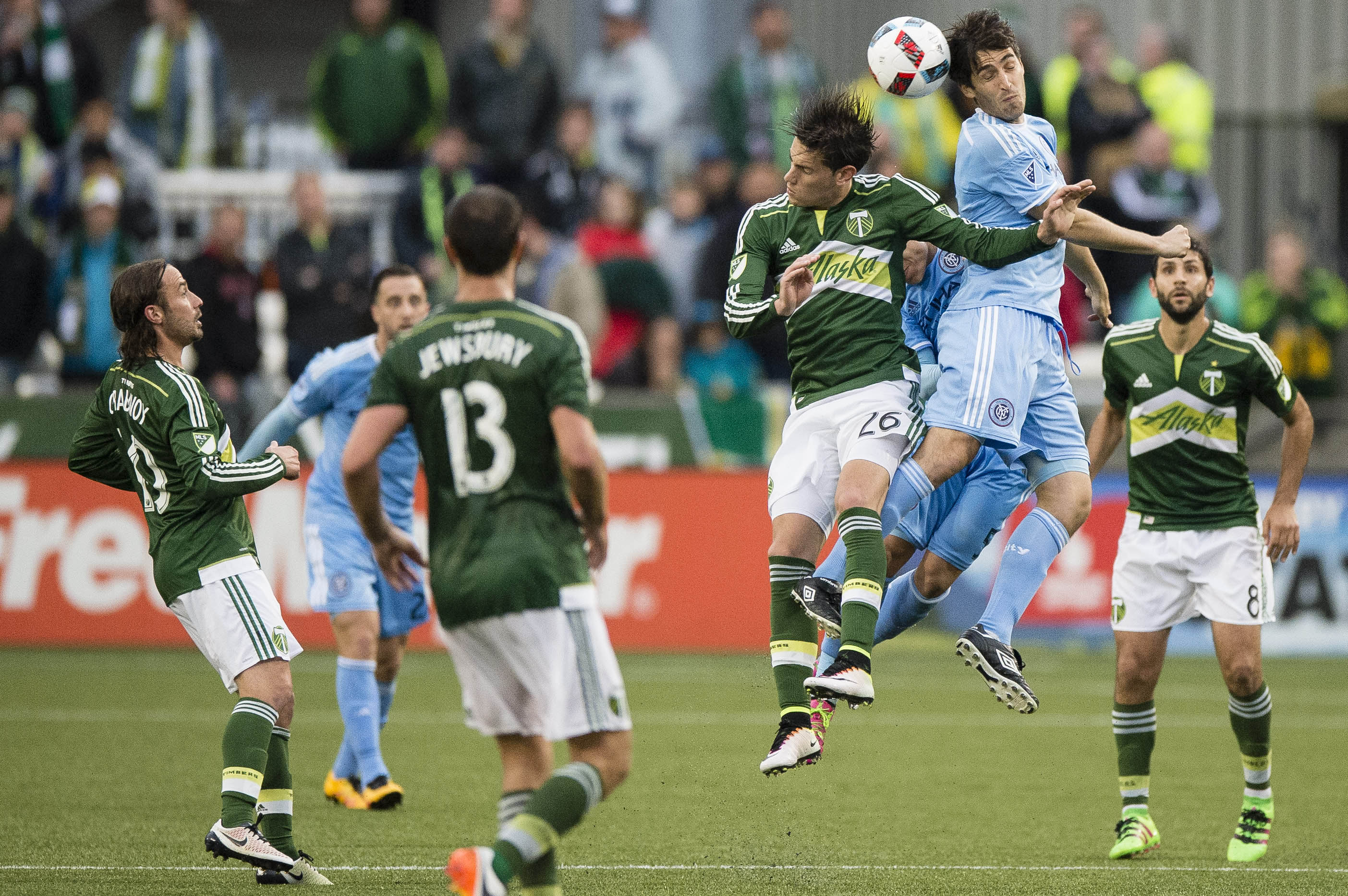 May 15, 2016; Portland, OR, USA; New York City FC defender Andoni Iraola (51) battles forward Lucas Melano (26) for a header during the second half at Providence Park. New York FC won 2-1. Mandatory Credit: Troy Wayrynen-USA TODAY Sports