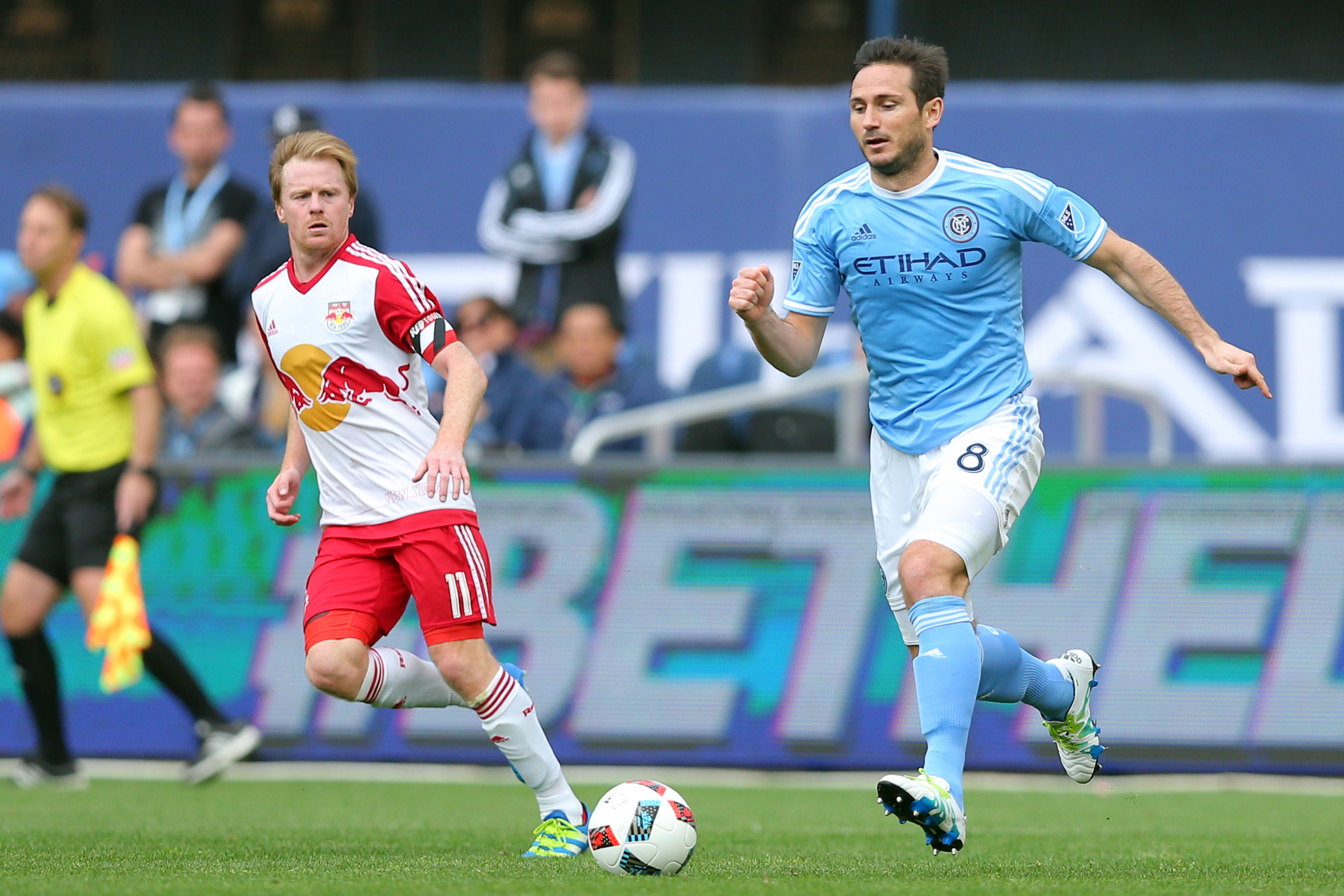 May 21, 2016; New York, NY, USA; New York City FC midfielder Frank Lampard (8) controls the ball against New York Red Bulls midfielder Dax McCarty (11) during the second half at Yankee Stadium. The Red Bulls defeated New York City 7-0. Mandatory Credit: Brad Penner-USA TODAY Sports