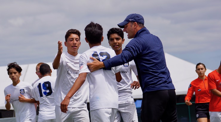 Youth Soccer News - Josh Henderson congratulates Surf SC 2002 Academy players after scoring a goal against Club America at Man City Cup Super Group match
