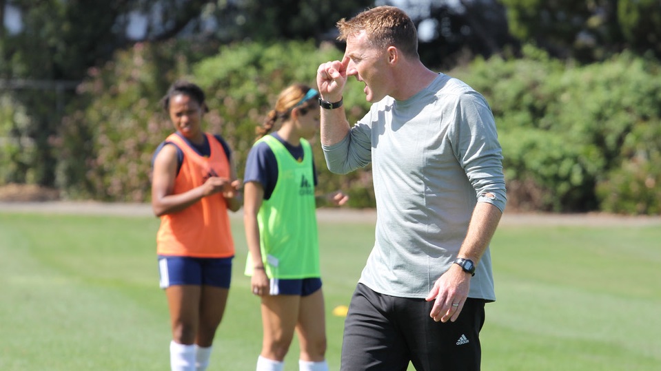 Scott Junpier coaching women's soccer in Orange County