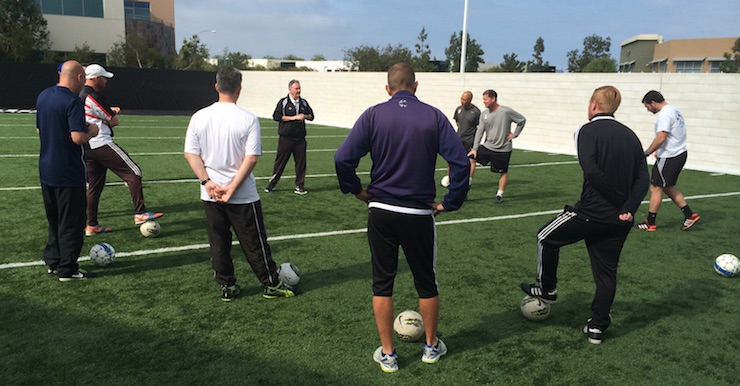 Dr. Ron Quinn conducting an outdoor training session with DOCs and youth coaches during the NYL