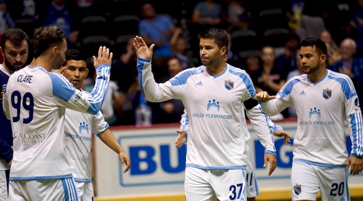 Soccer News: Captain Kraig Chiles celebrates with team after scoring a goal