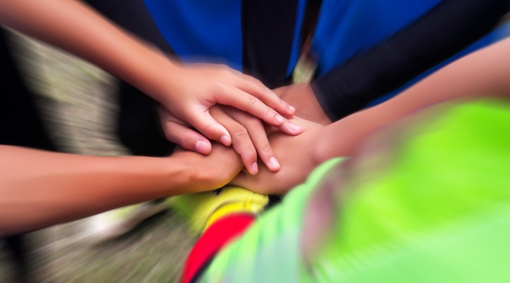 Huddle of hands • SoccerToday