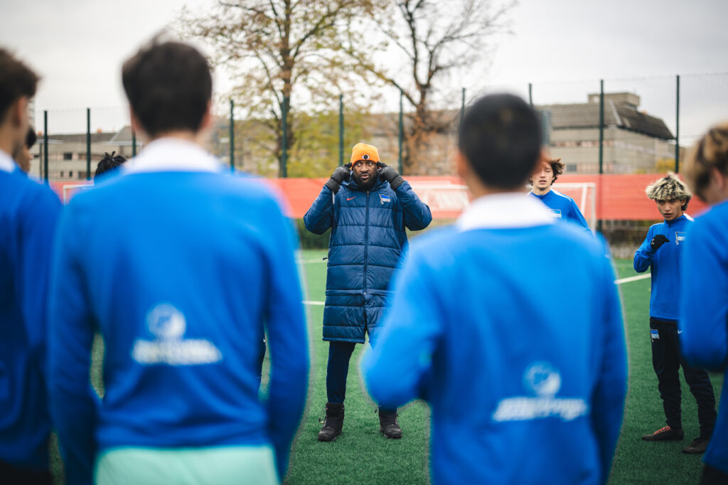 Performance Coach Francis Kioyo training his American youth soccer team players in Germany at Hertha BSC